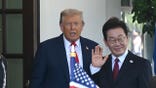 President Donald Trump greets South Korean President Lee Jae-myung