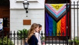 Progress Pride flag hanging outside St. John's Lutheran Church near Stonewall Monument in New York City
