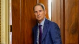 Ron Wyden looks on