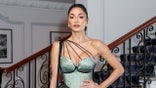 Nicole Scherzinger poses in front on staircase