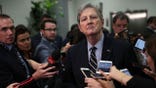 Sen John Kennedy speaks to reporters