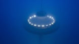 A mystery UFO lights up underwater