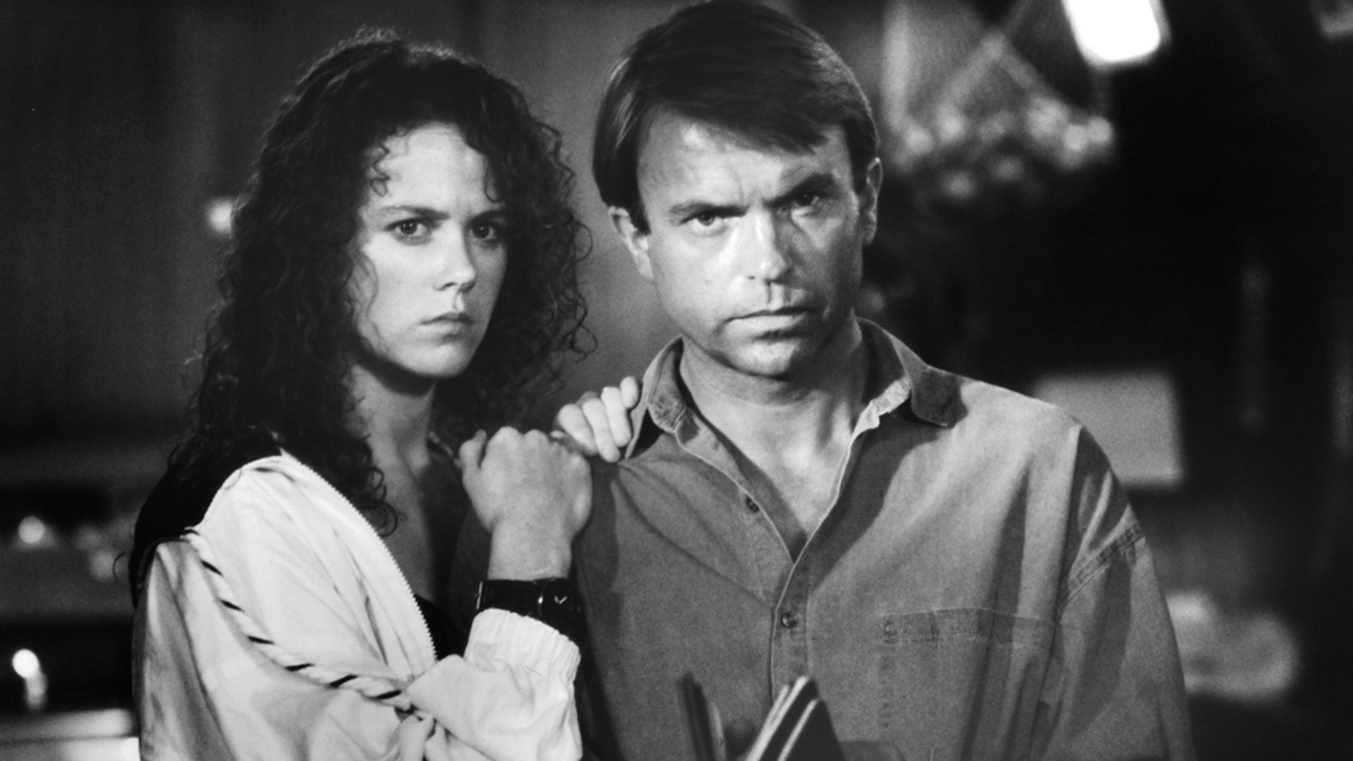 A black and white photo of Nicole Kidman and Sam Neill on set of "Dead Calm" in 1989.