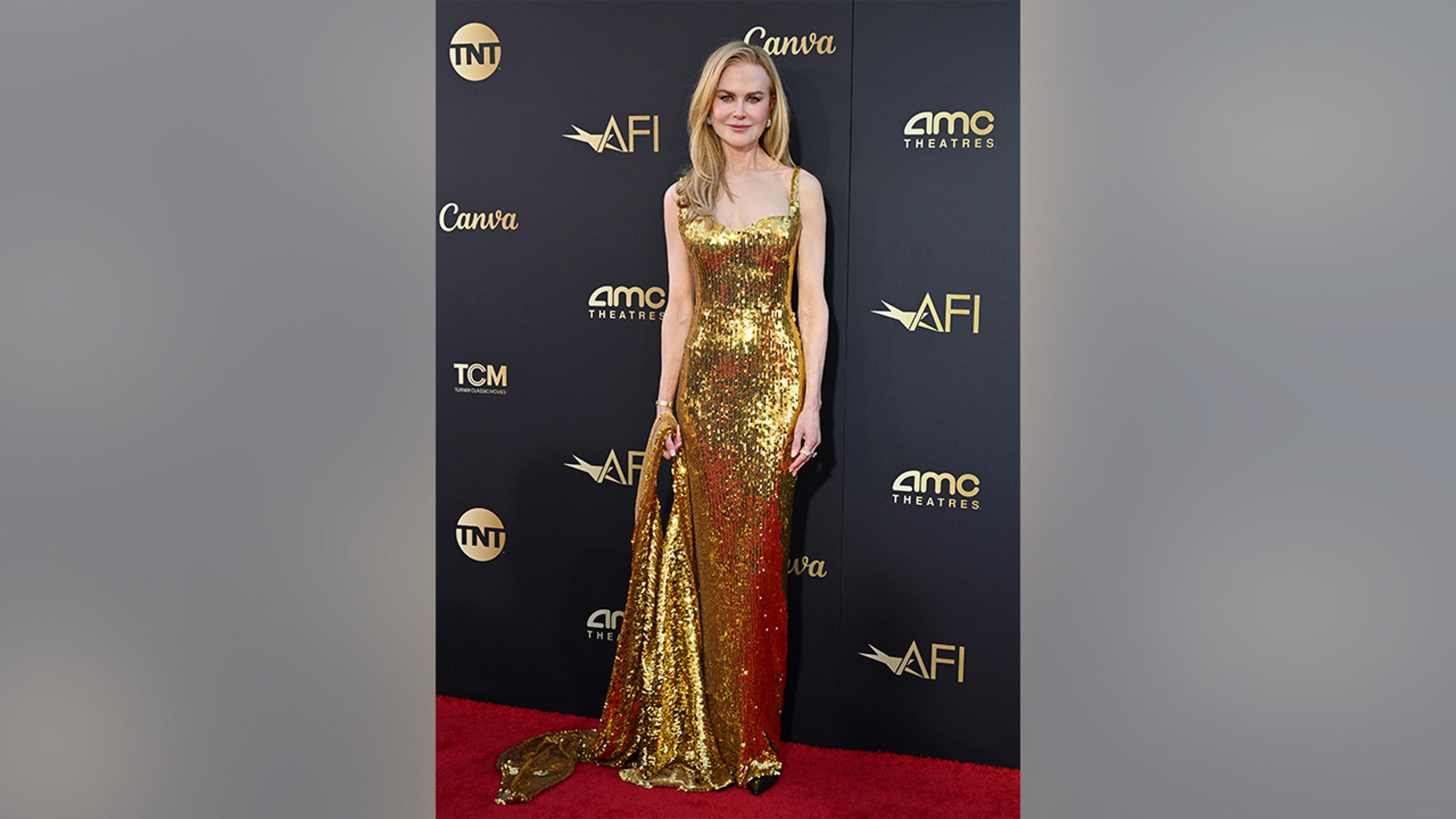 Nicole Kidman in a gold dress at the AFI Life Achievement Award Gala Tribute in April 2024.