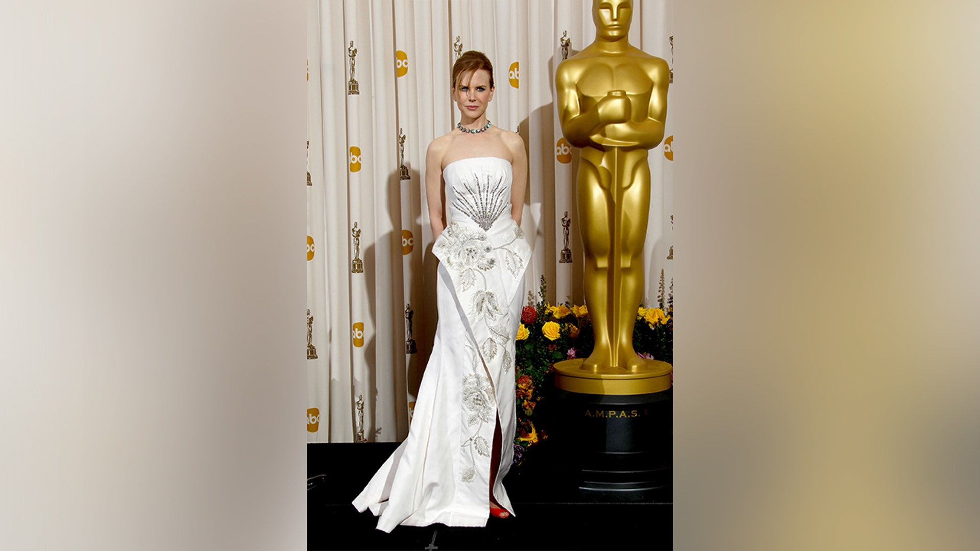 Nicole Kidman in a white dress at the Academy Awards in 2011.