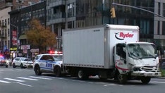 Truck hits parked van in Midtown Manhattan, pushing vehicle onto sidewalk and injuring 9