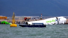 Hong Kong cargo plane skids off runway, killing 2
