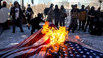 'Antifascist' law student defies university policy with American flag burning tailgate - Fox News