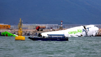 Hong Kong cargo plane skids off runway, killing 2