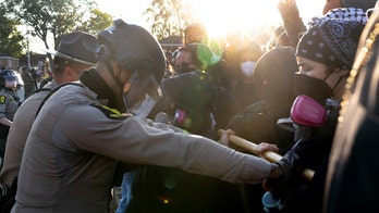 DHS says ICE agents in Chicago suburb 'boxed in by 10 cars' as tensions escalate