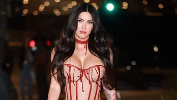 Megan Fox makes rare public appearance in blood-dripping gown after giving birth in March