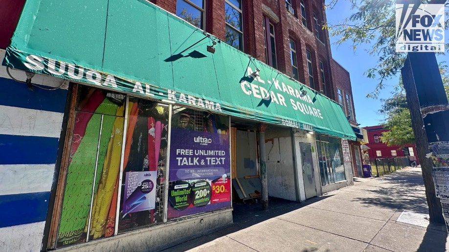 Al-Karama Cedar Square shop with green awning in Minneapolis