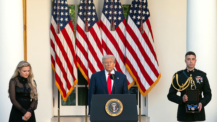 President Donald Trump speaks alongside Erika Kirk
