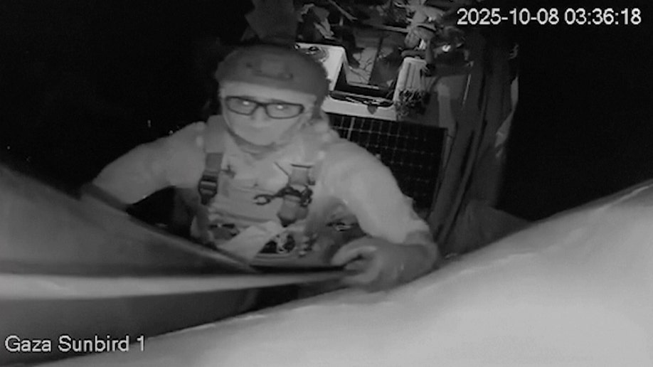 Someone looks at the camera as Israeli forces intercept Gaza-bound flotilla