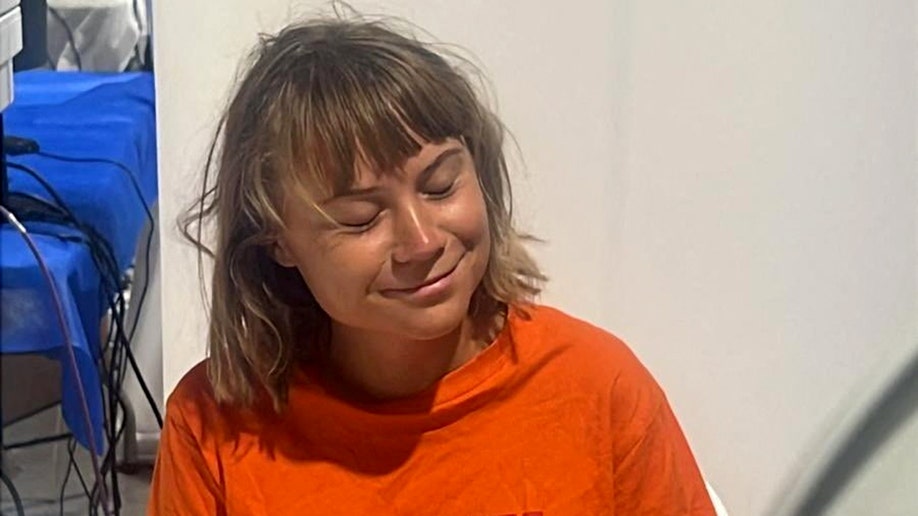 Swedish activist Greta Thunberg in an orange t-shirt