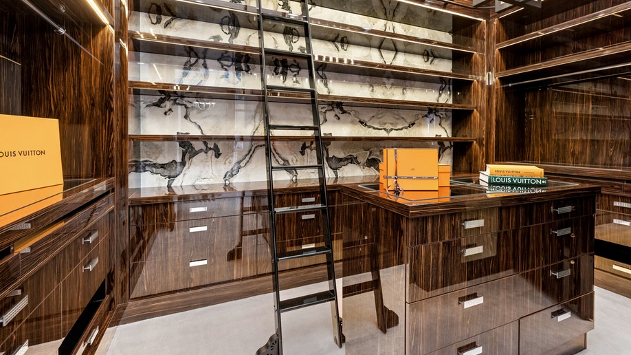 The closet in a bedroom featuring a ladder at Mark Wahlberg's home