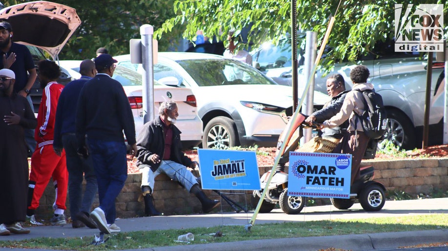 Men outside mosque with campaign signs in Cedar–Riverside Minneapolis