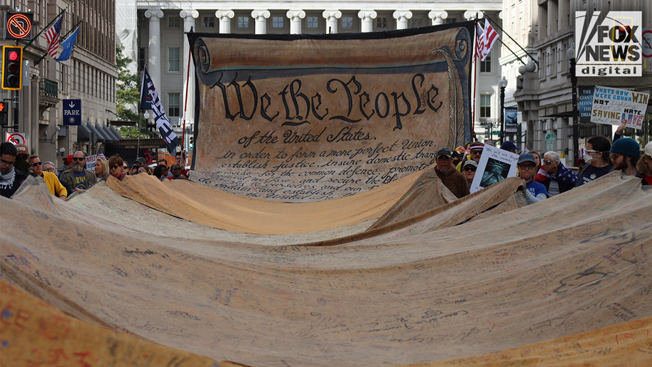 In Photos: Bernie Sanders, costumed demonstrators rally against Trump at No Kings Day protest  at george magazine