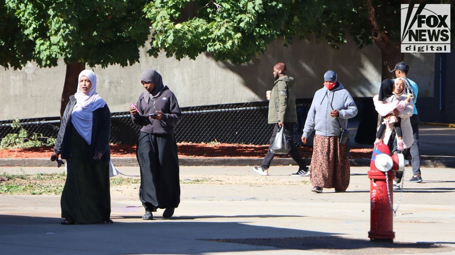 Pedestrians walking in Cedar–Riverside Minneapolis