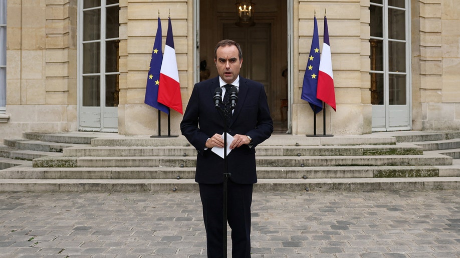 Sebastien Lecornu speaking outside building