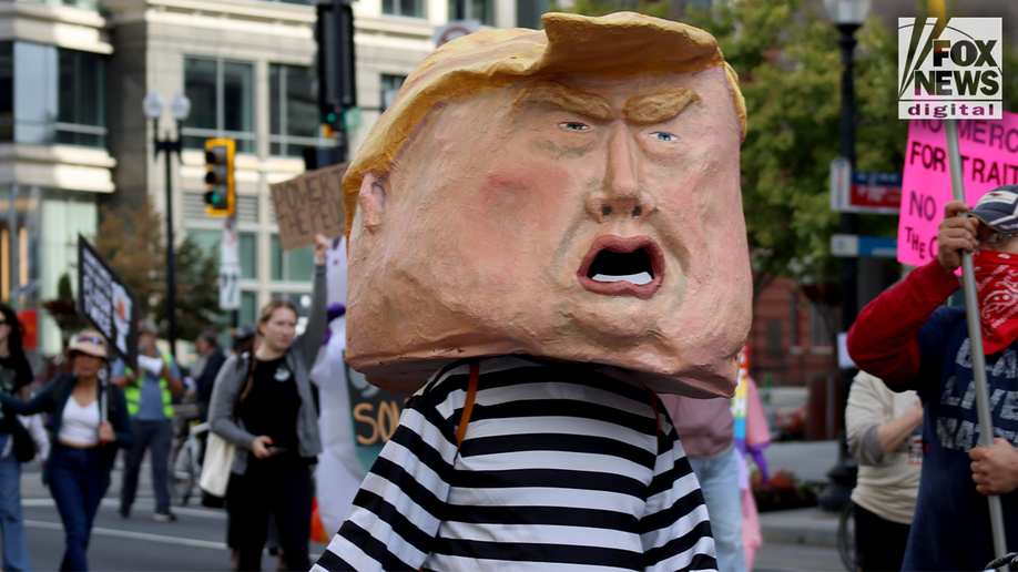 In Photos: Bernie Sanders, costumed demonstrators rally against Trump at No Kings Day protest  at george magazine