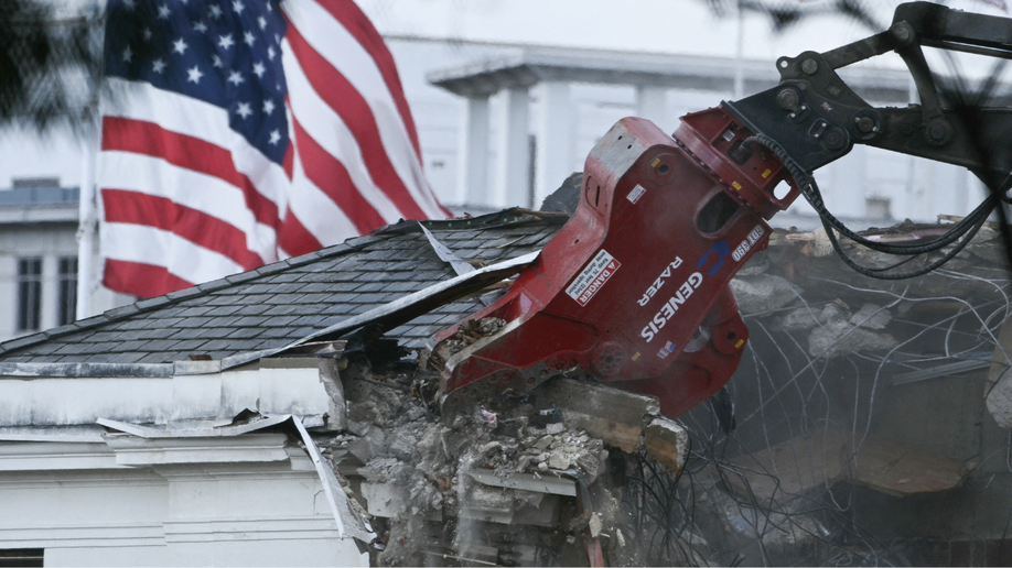 Heavy machinery tears down a section of the East Wing of the White House