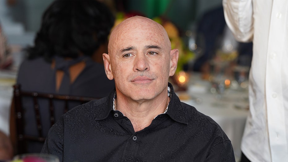 Robert Cityrone sits down at a dinner party in New York