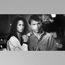 A black and white photo of Nicole Kidman and Sam Neill on set of "Dead Calm" in 1989.