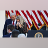 Erika Kirk walks with President Donald Trump