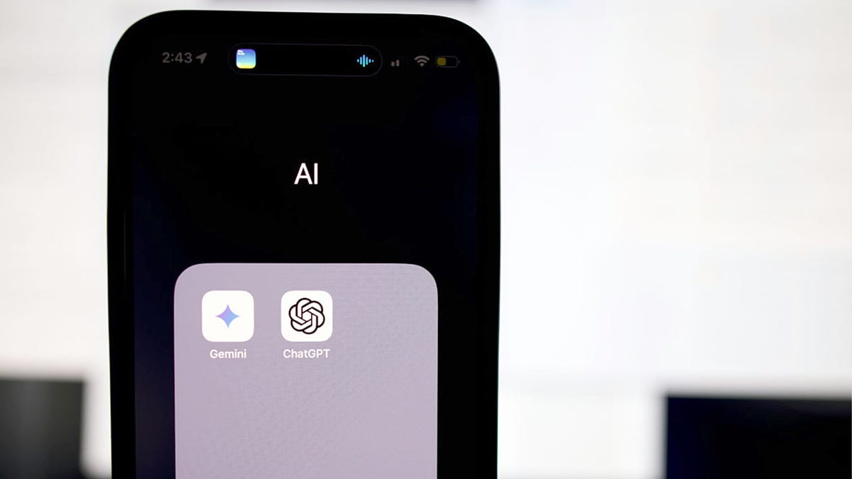 Gemini and ChatGPT apps are seen on a smartphone.