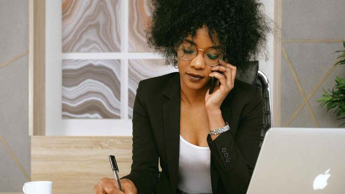 A woman speaks on her cell phone.