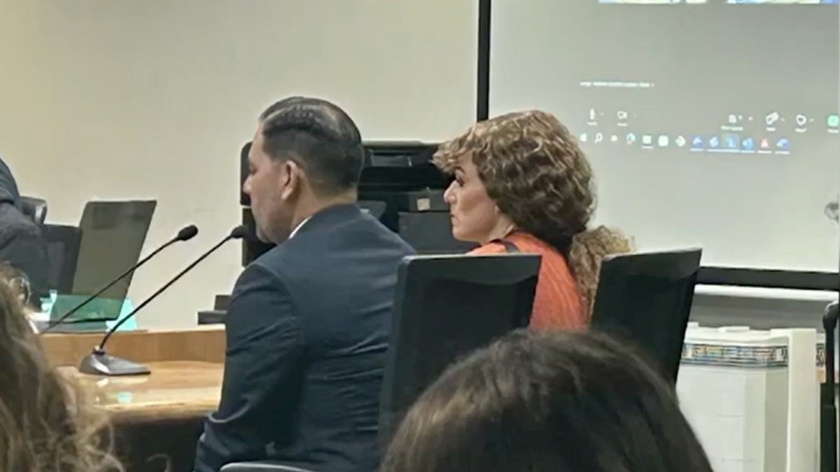 Ashlee Buzzard in court with her lawyer