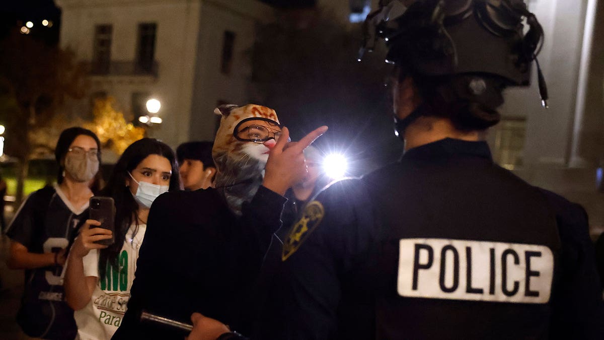  Protesters confront University of California police outside of a Turning Point USA event at the University of California, Berkeley (UC Berkeley) on November 10, 2025 in Berkeley, California. The event was the last stop of a tour begun by group founder Charlie California. The event was the last stop of a tour begun by group founder Charlie Kirk that has since served as a series of memorials for Kirk, who was fatally shot at an event in September. (Photo by Justin Sullivan/Getty Images)