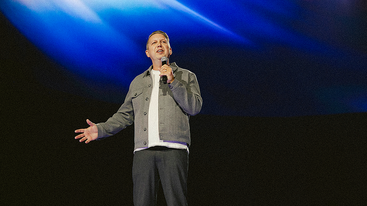 Bible app YouVersion founder on stage at event commemorating over 1 billion downloads