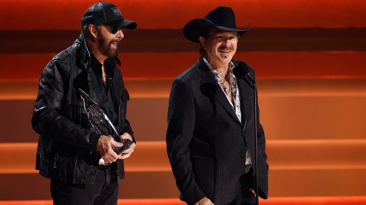 Brooks and Dunn accepting their award at the CMA Awards.