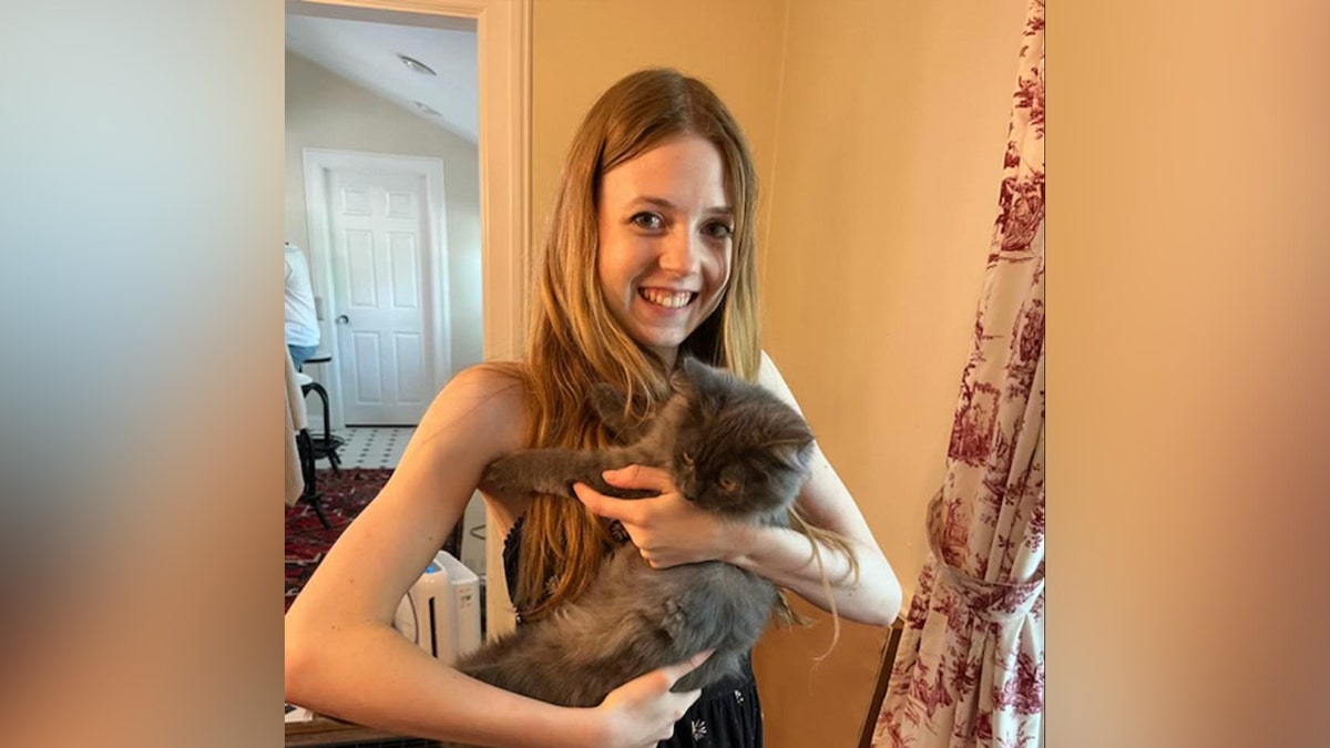 Bethany MaGee holding a cat.