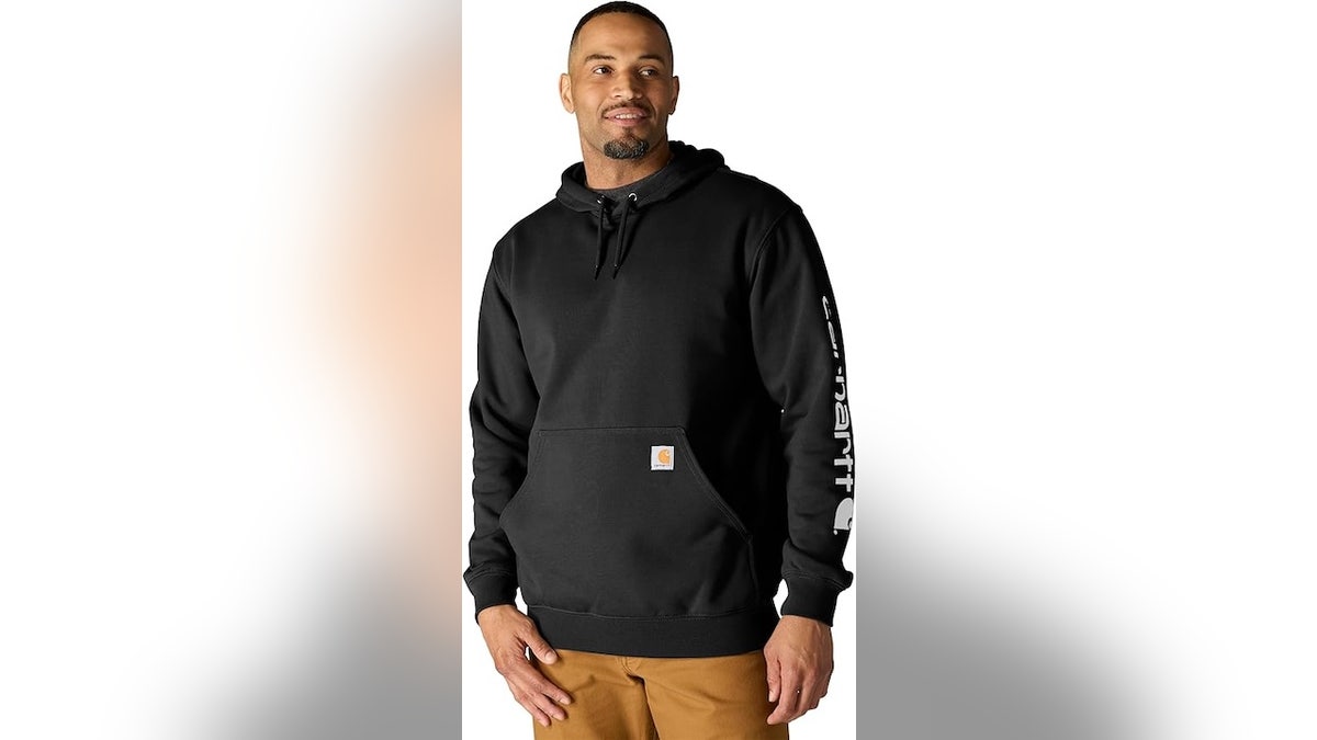 A loose fitting sweatshirt with Carhartt’s classic logos. 