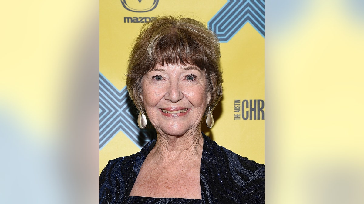 A close-up of Charlotte Stewart on the red carpet.