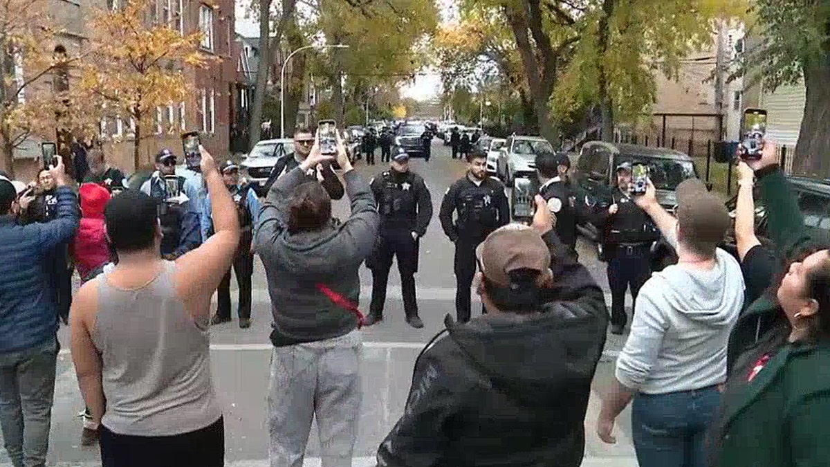 Police officers barricade a street in Chicago's Little Village neighborhood.