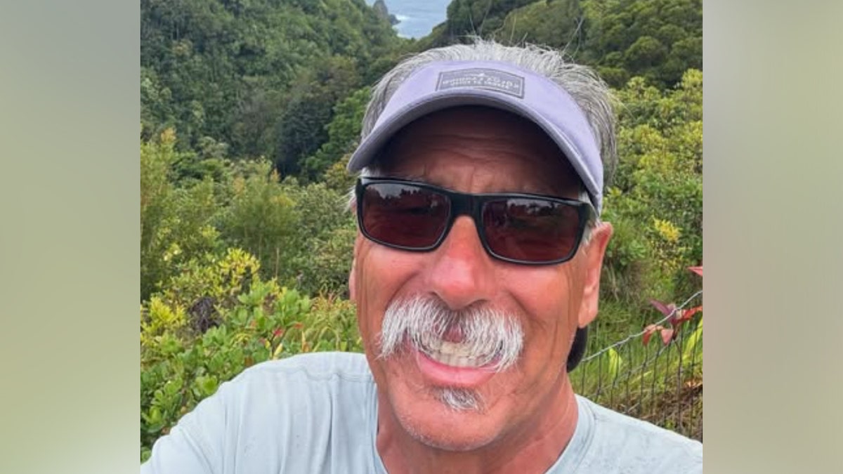 Coach John Beam smiles in a selfie