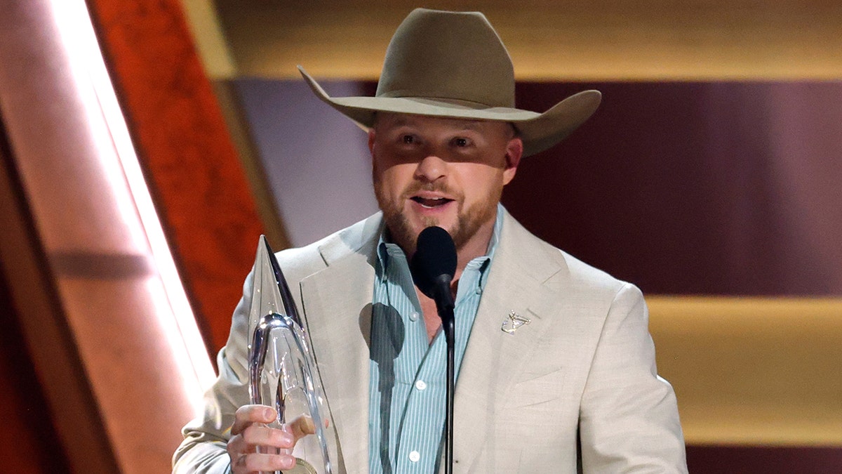Cody Johnson accepting his award at the 2025 CMA Awards.