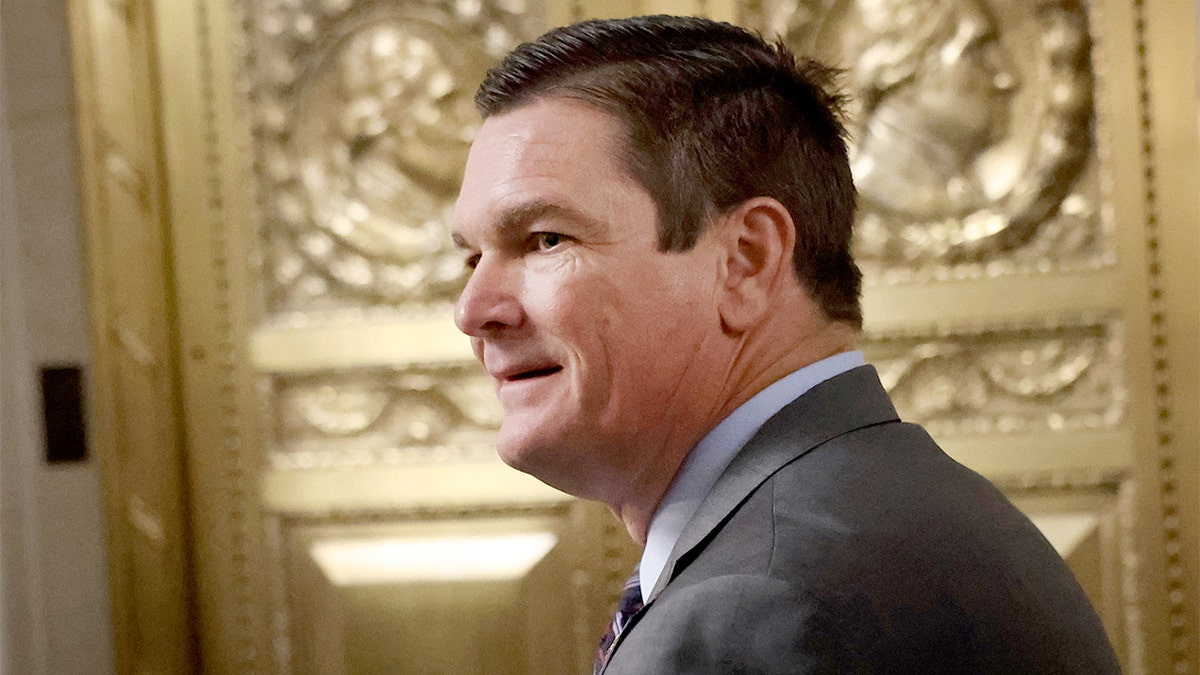 U.S. Representative Austin Scott walks through the hallway before a House Republican candidates forum on Capitol Hill.