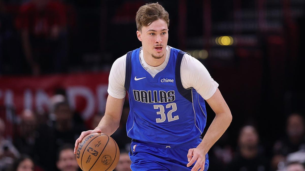 Cooper Flagg dribbles on court