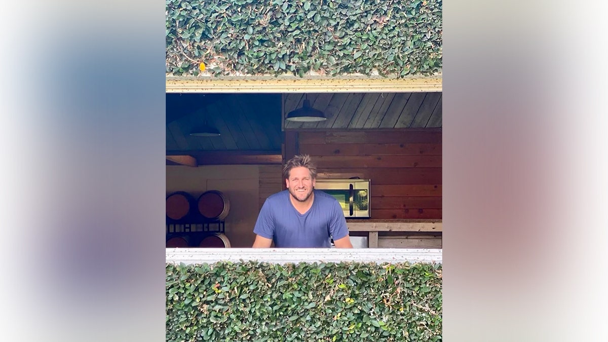 Curtis Stone posing at this farm in an image he shared to Instagram