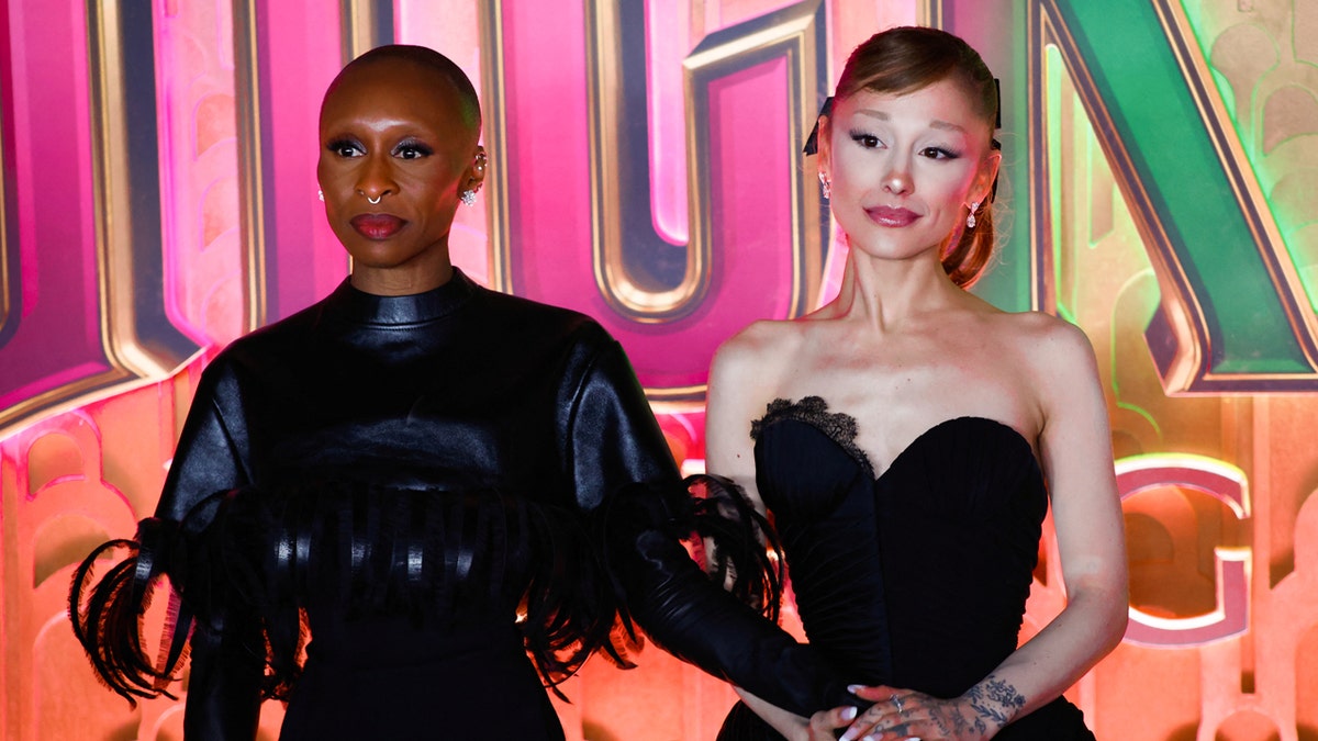 Cynthia Erivo and Ariana Grande hold hands at the Wicked NYC premiere