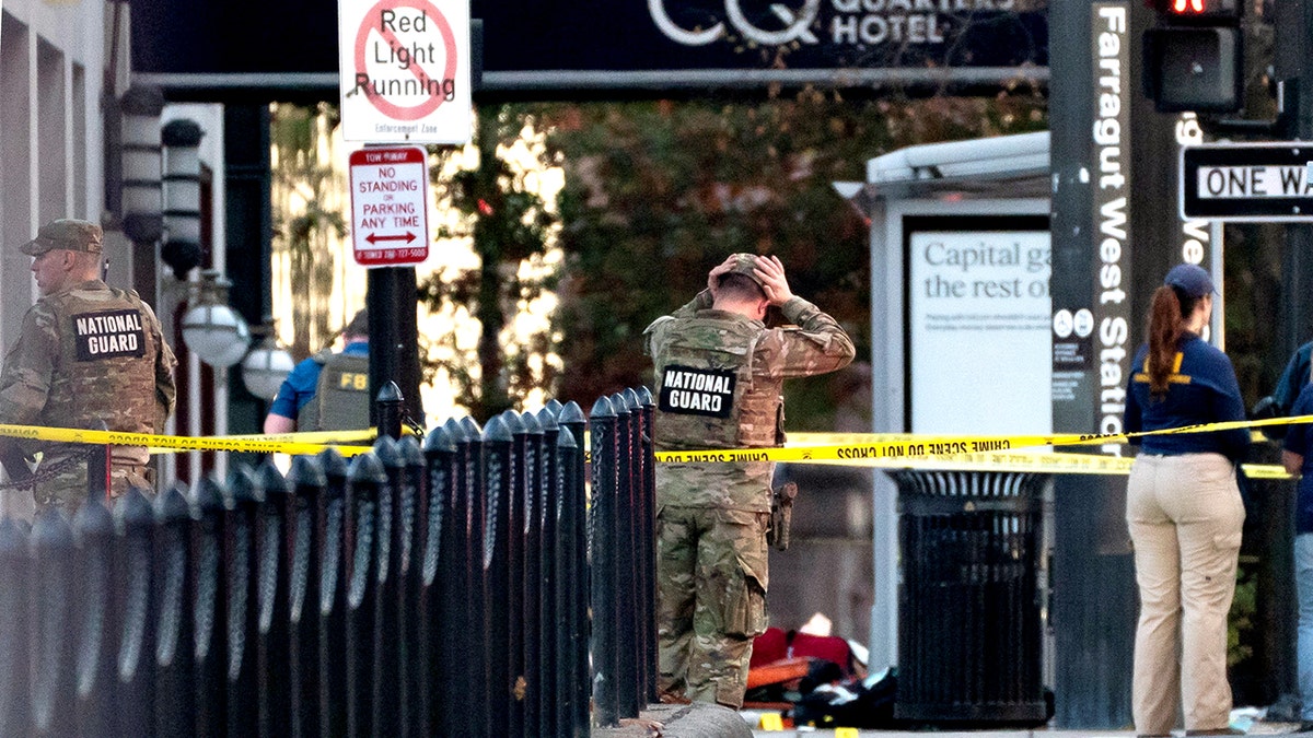 National Guard members stand by shooting scene