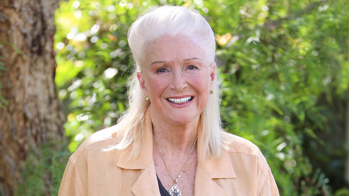 Diane Ladd smiling while outside
