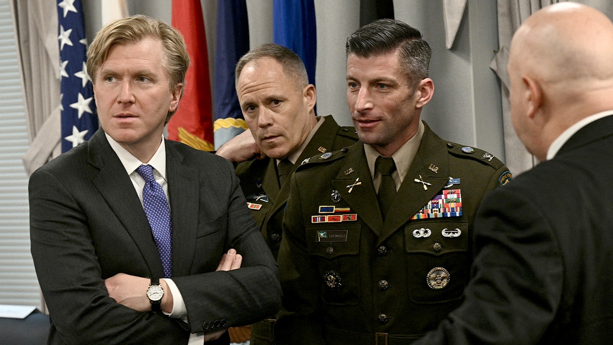 U.S. defense officials wait in a conference room before a meeting with Peruvian ministers at the Pentagon.