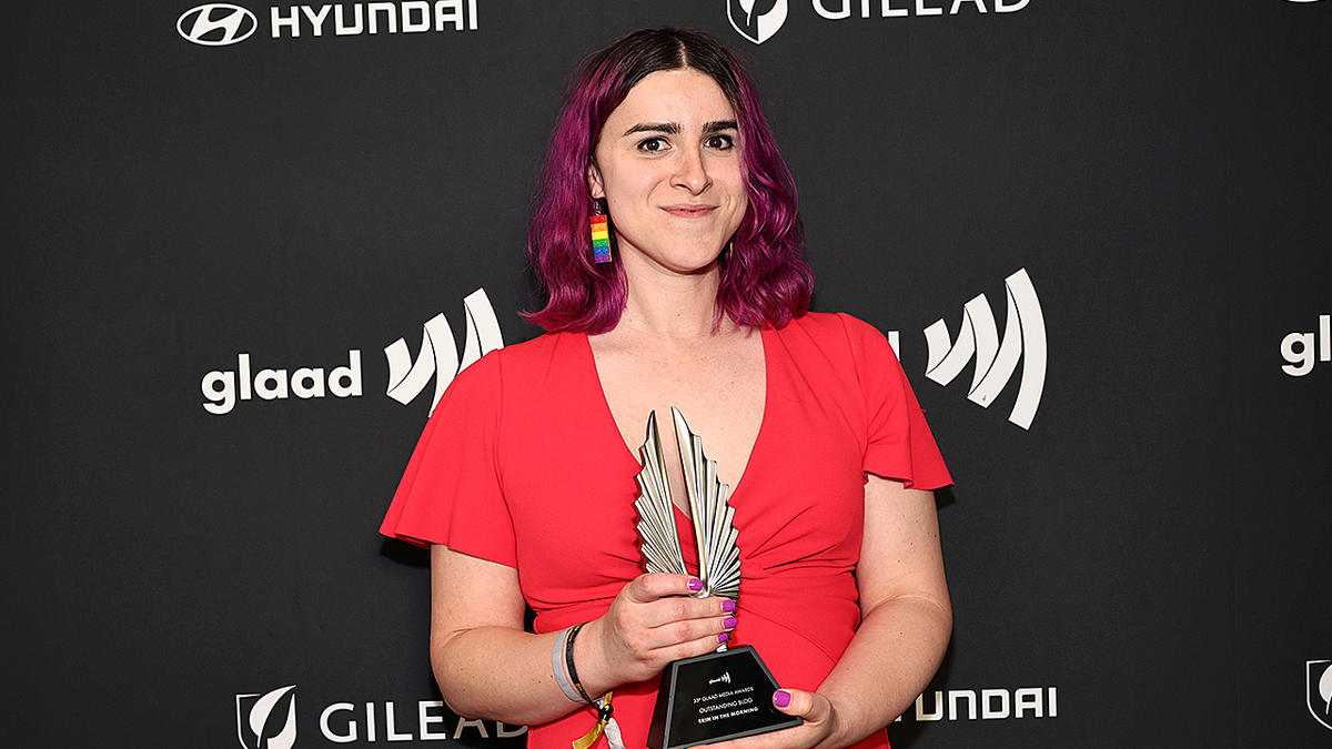 Erin Reed posing with GLAAD Award