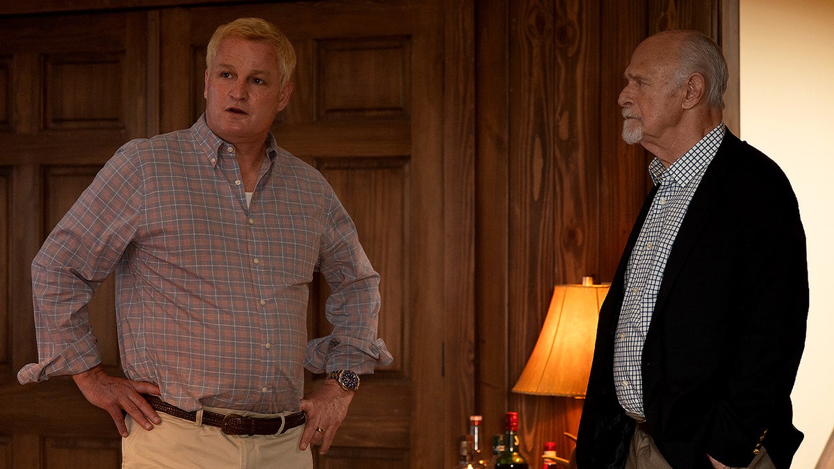Jason Clarke and Gerald McRaney stand in a wood-paneled room during a tense conversation in Murdaugh: Death in the Family episode